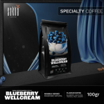 Blueberry Wellcream specialty coffee 100gr bag packaging displayed on dark set with curtain backdrop